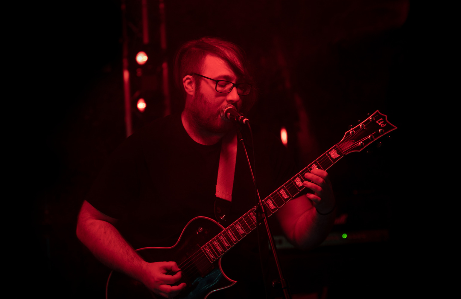 Chris shredding guitar and singing